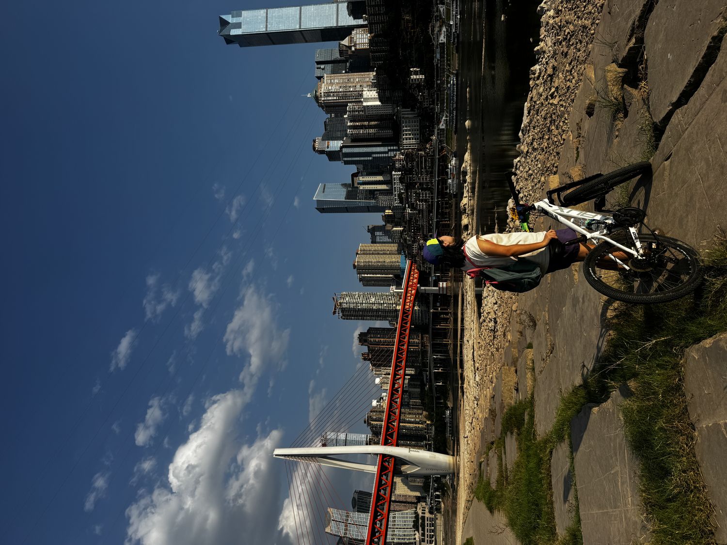 Cyclist with Dongshuimen Bridge and skyline
